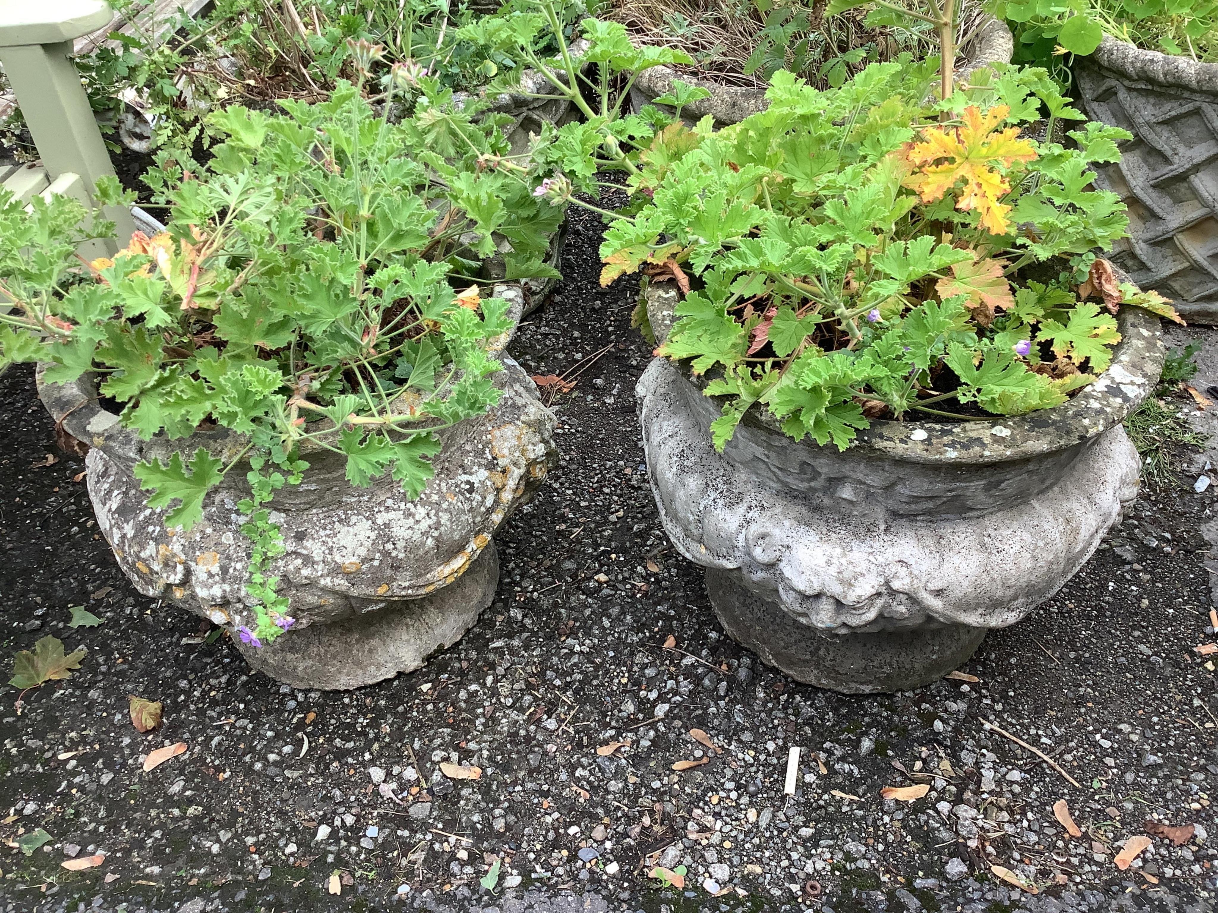 A pair of circular reconstituted stone garden planters, diameter 49cm, height 42cm. Condition - poor to fair